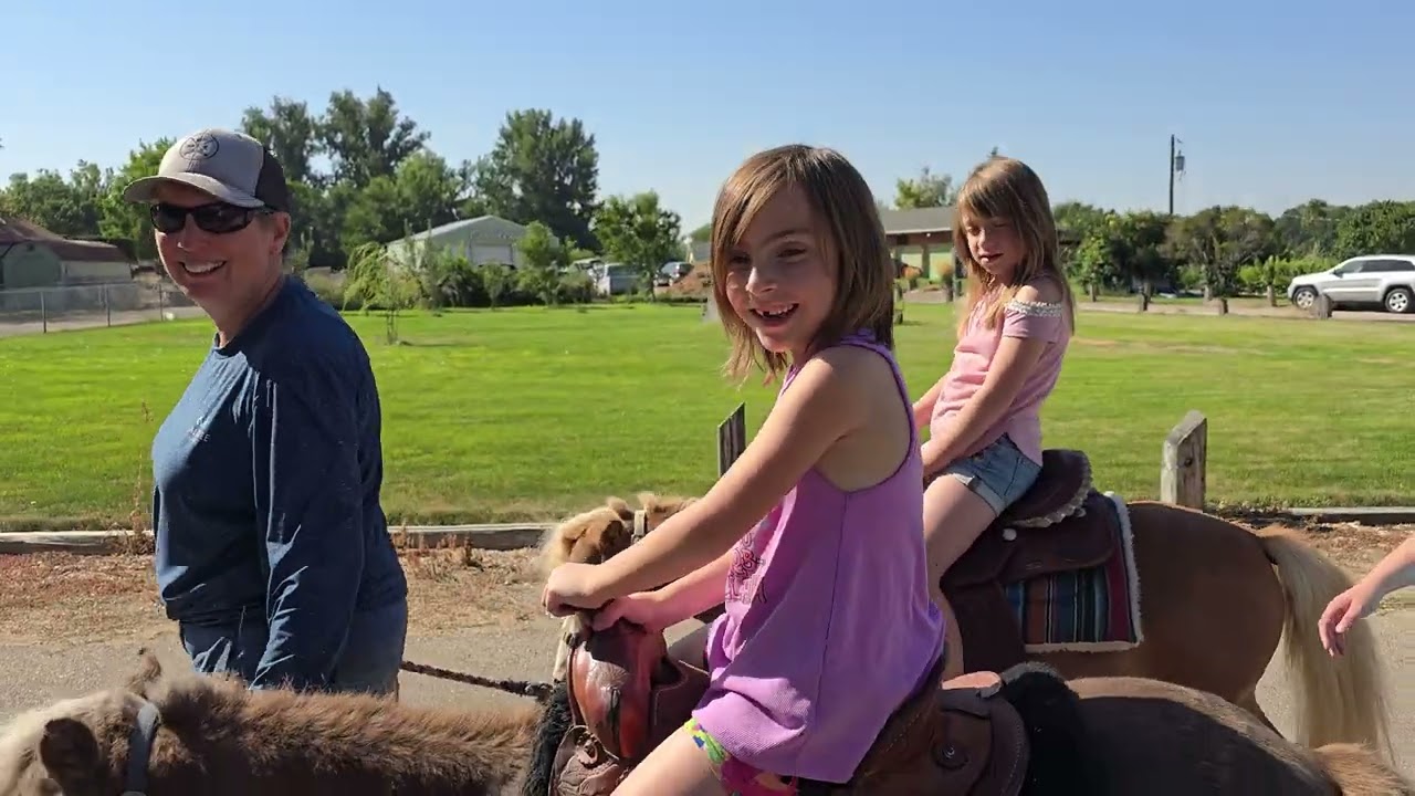 Girls riding mini horses 