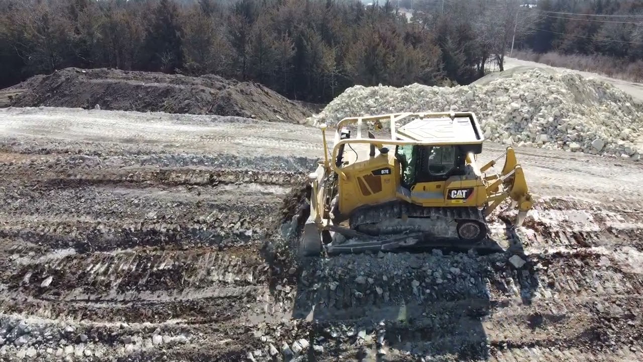 Caterpillar Bulldozer D7E pushing up berms