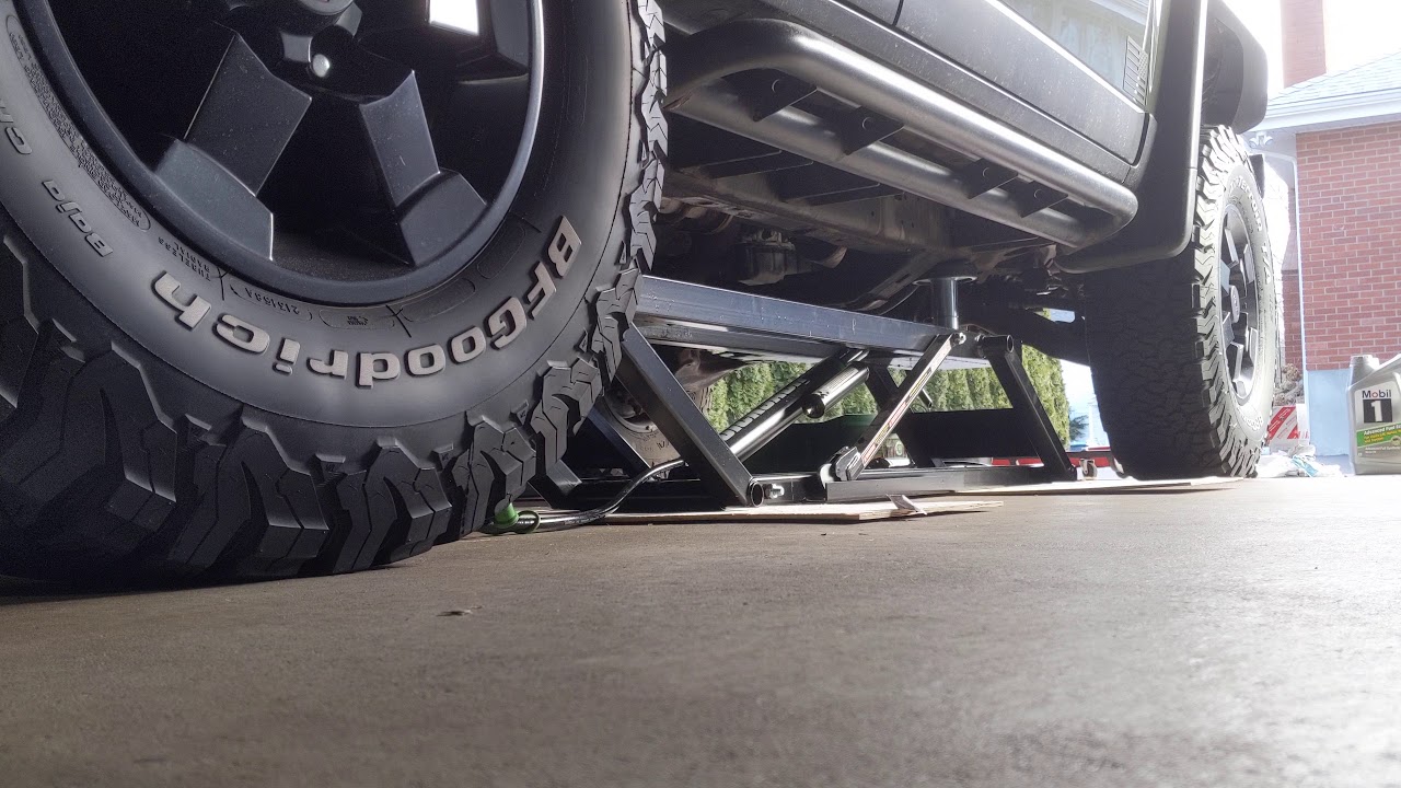 QuickJack BL-7000SLX with SUV adapters in action on my FJ Cruiser