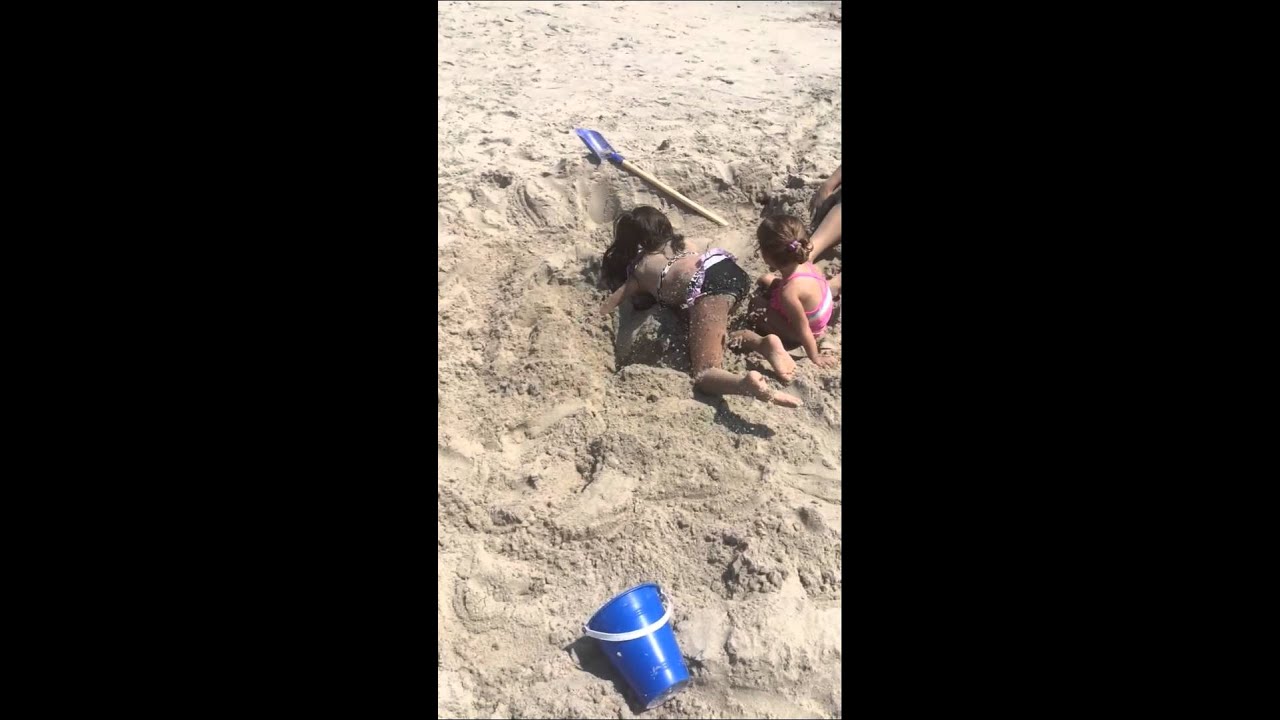 Bella buried in sand summer 2015