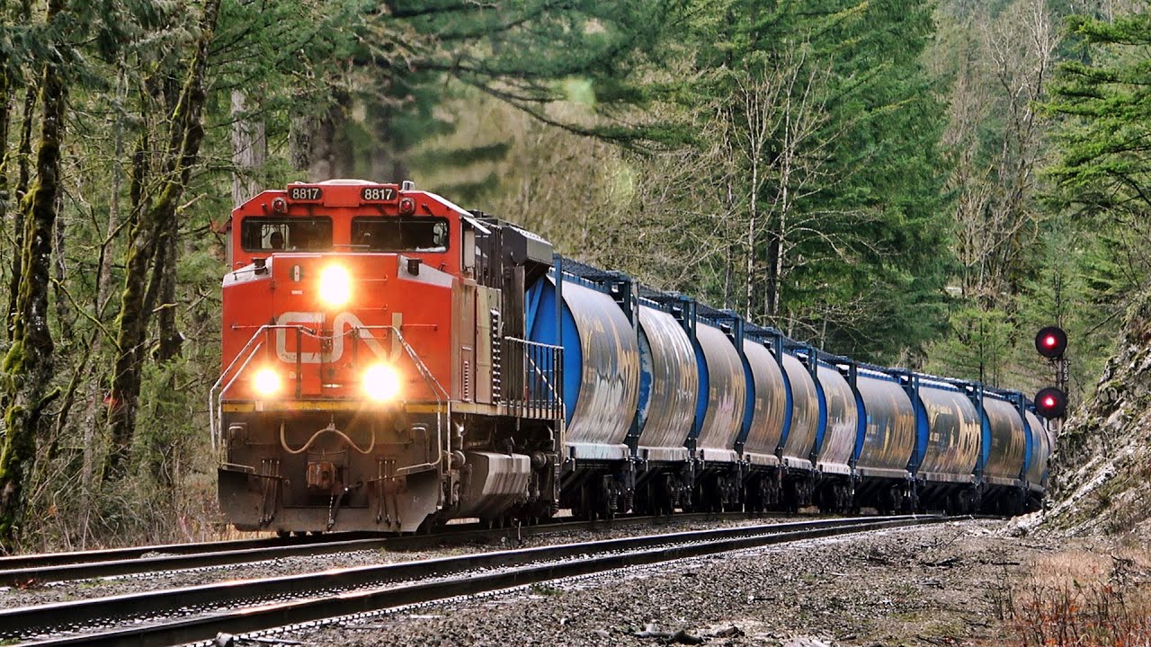 EMD Locomotives Pull Monster Size Grain Train Over Big Steep Grade! w/ DPU & Alberta Hoppers!