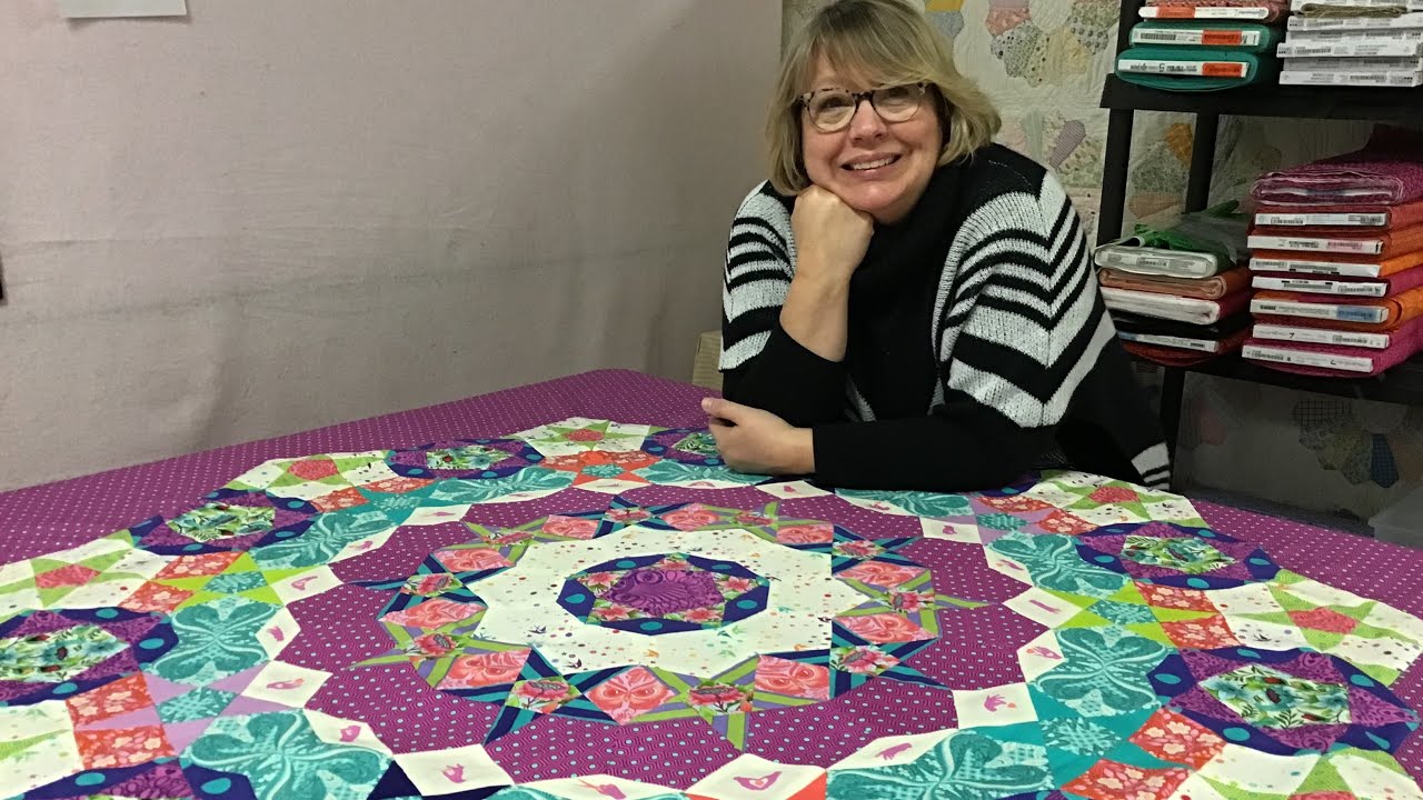 Tula Pink Tula Nova English Paper Piecing attaching the quilt to the background!