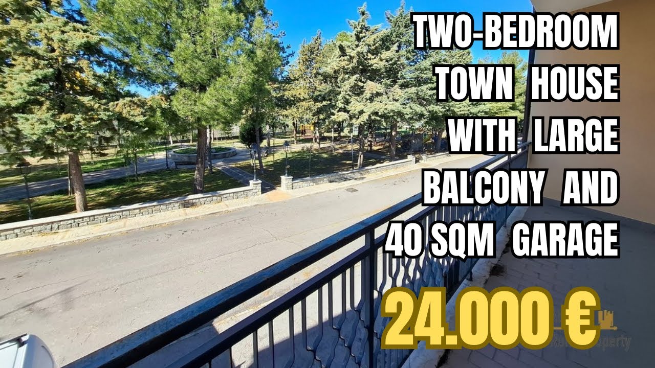 Two-bedroom town house with large balcony and garage. Palmoli