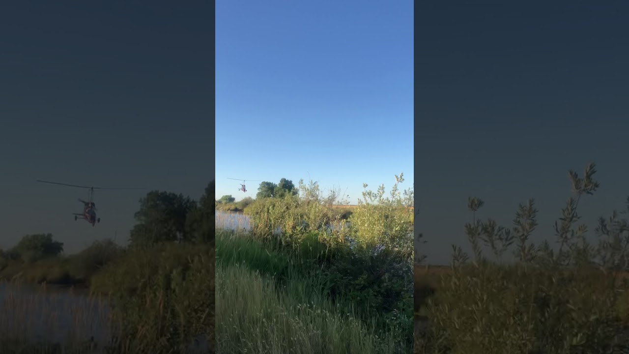 Gyrocopter low fly by over water