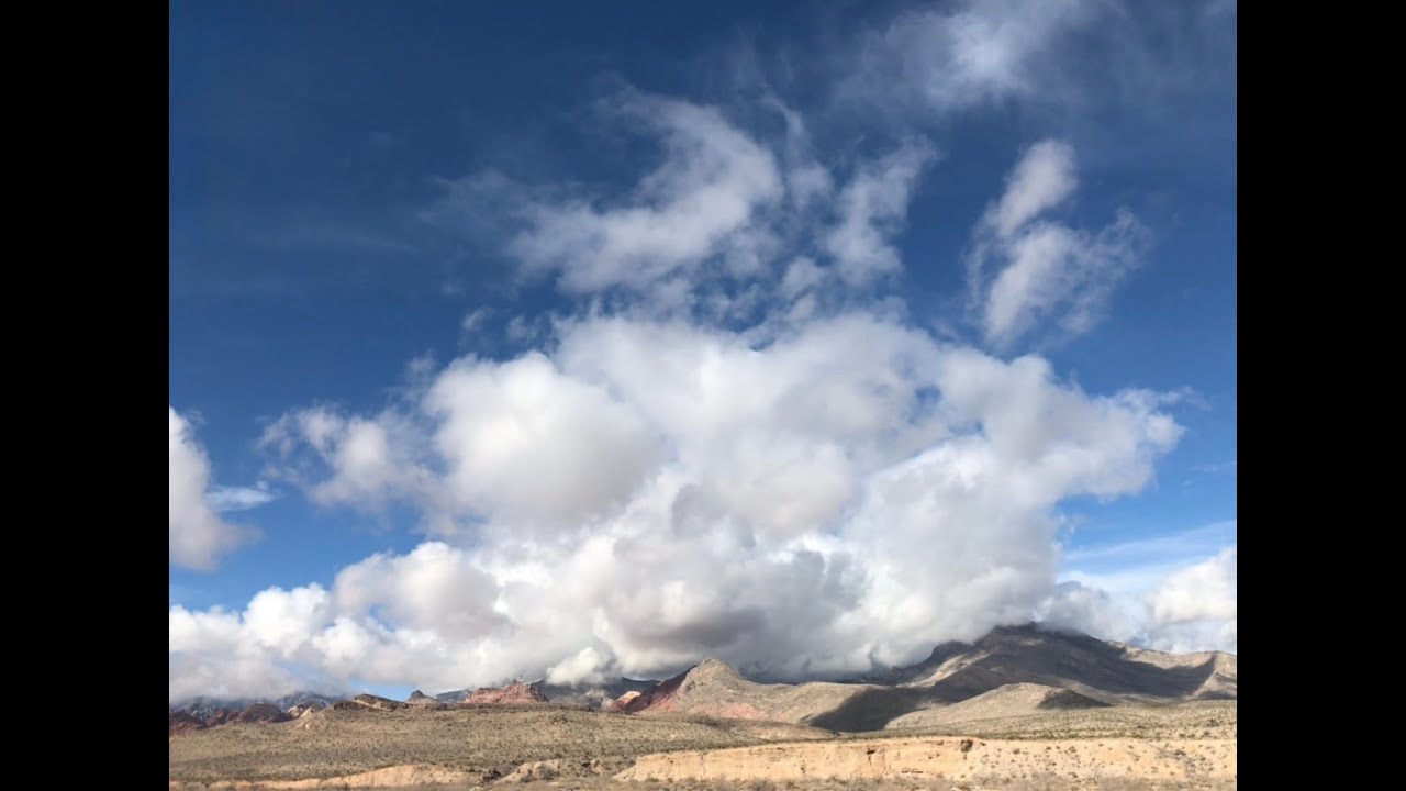 Clouds Rolling Over Desert Mountains | Peaceful Sky View