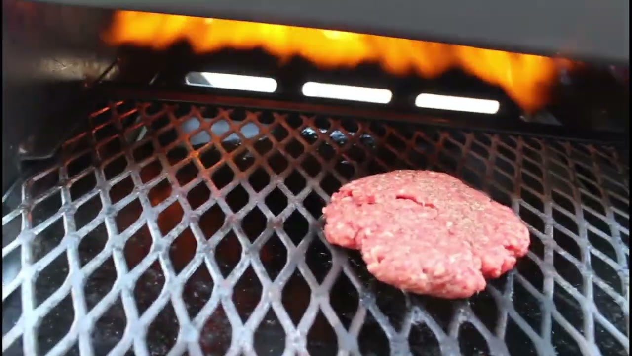Broiling a hamburger on the RV Works Cajun Bayou Broiler