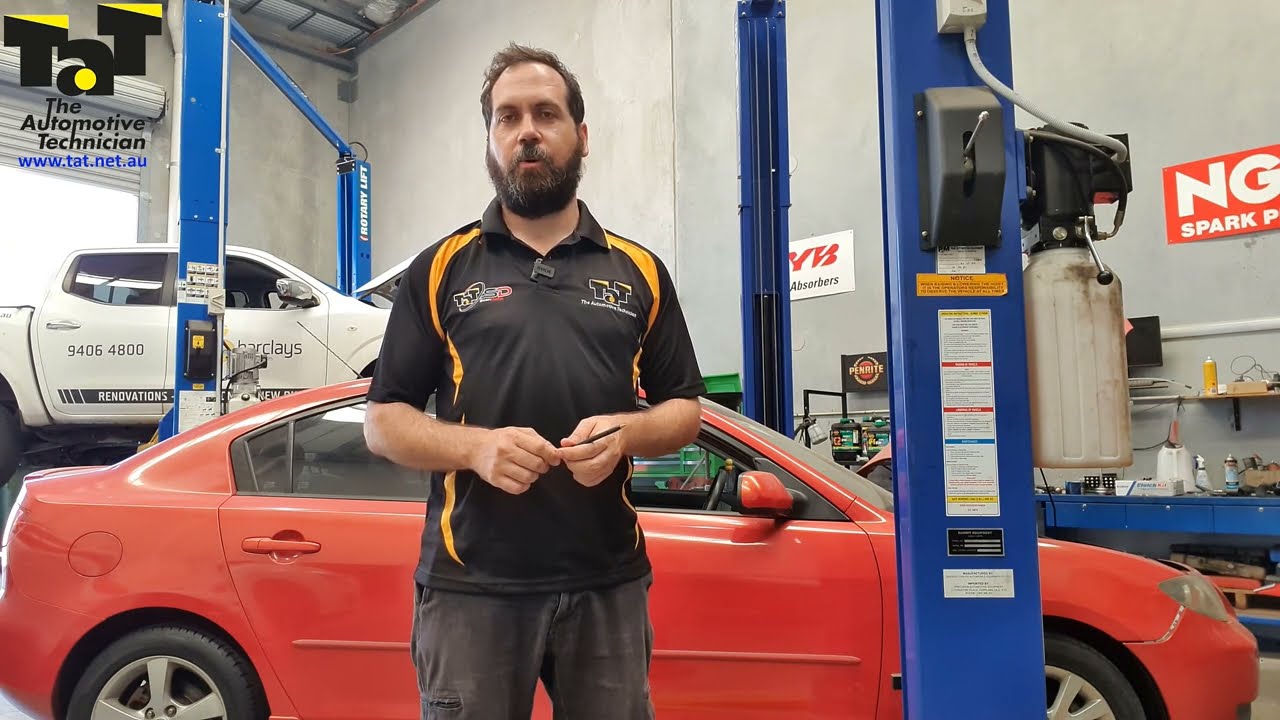 Mazda 3 with the Engine and AT warning lights on.