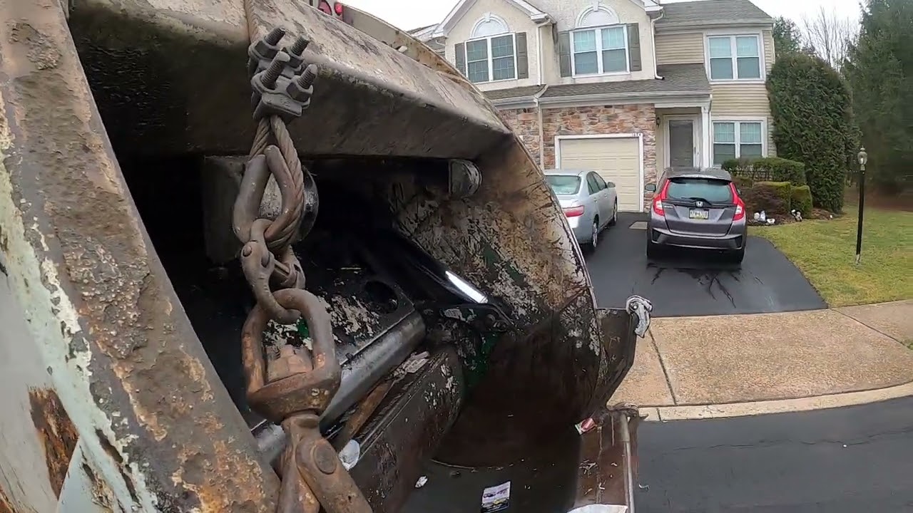Garbage man POV: Manual trash on a Mack MR McNeilus rear loader garbage truck Part 2