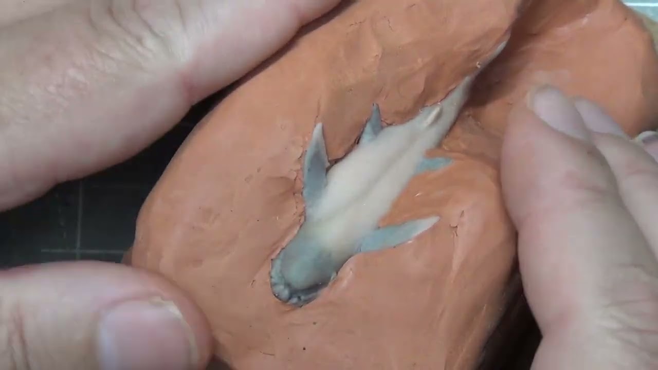 Dunkleosteus sculpted with polymer clay, molded and cast in pewter and resin