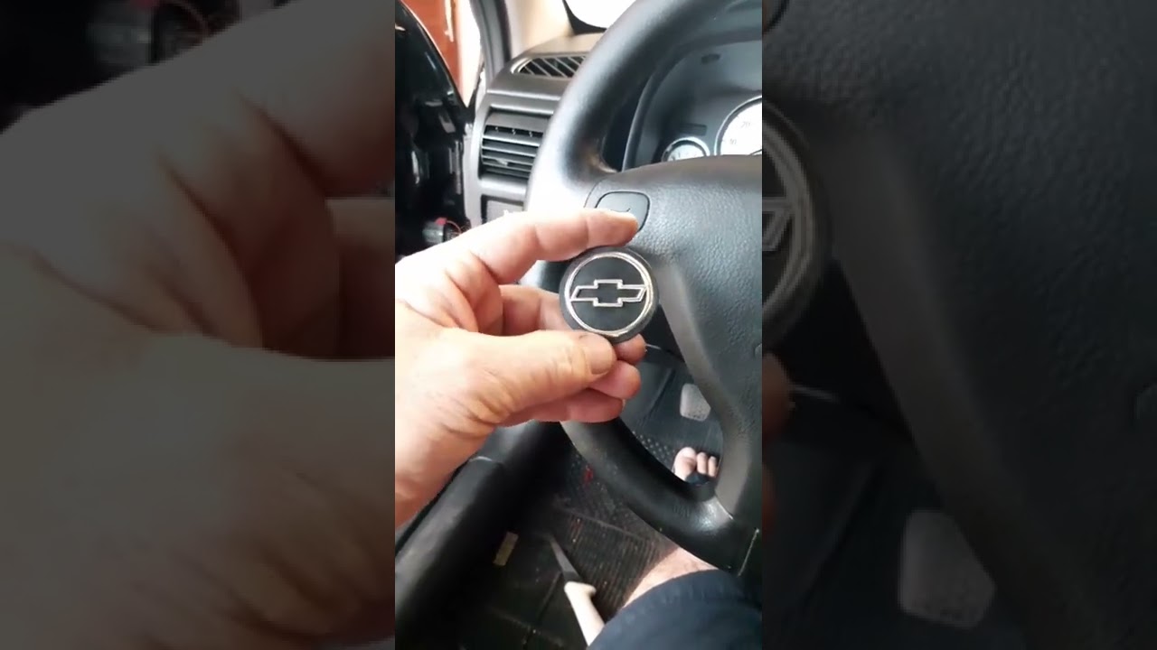 como troca a tampa do volante do astra com Airbag