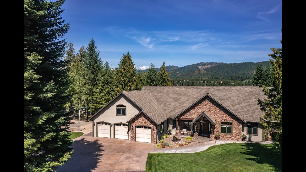 Discover the absolute impeccable estate home built for generations with shop in Priest River Idaho.