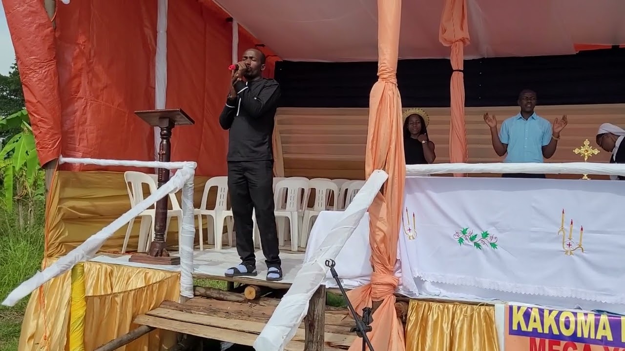 Fr Kafeero leading worship with the youths of Isingiro