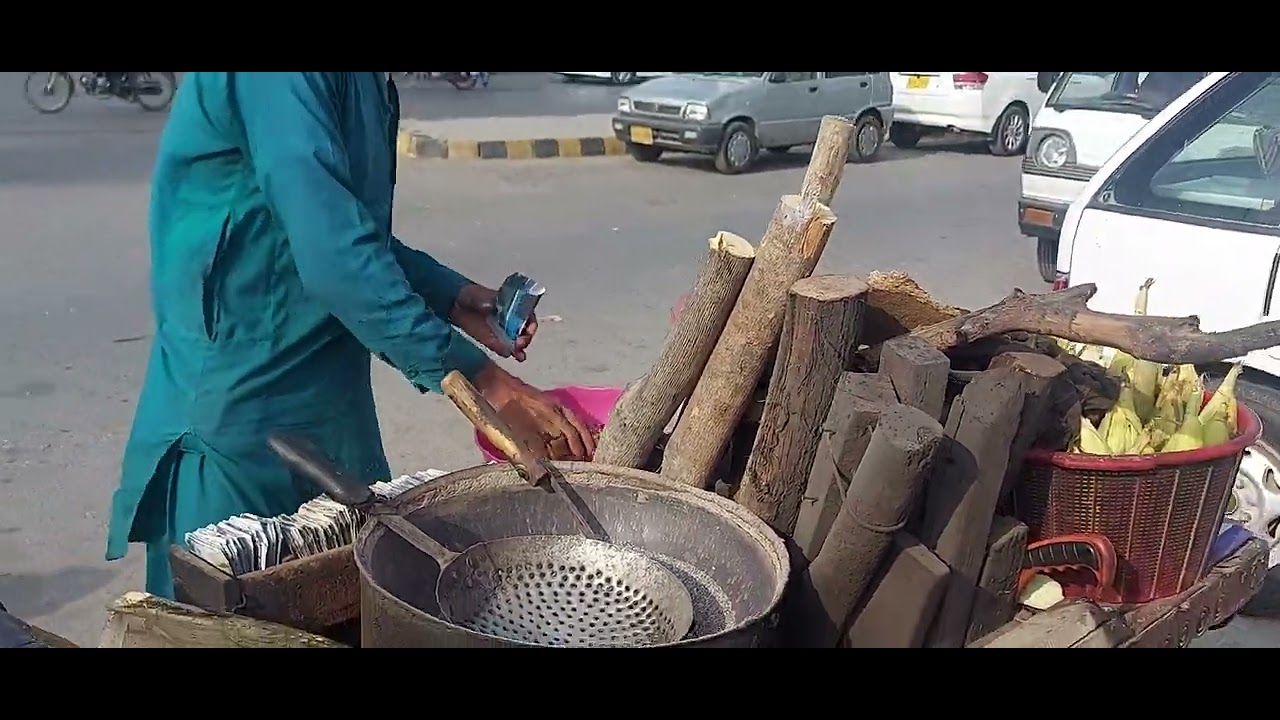Makai,Eating Corn, Butta At Street Food At Karachi (Pakistan)