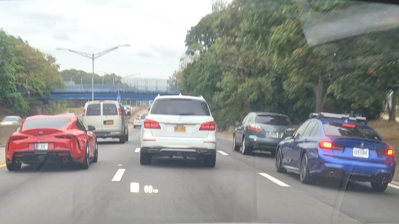3 different bmw's swimming in traffic