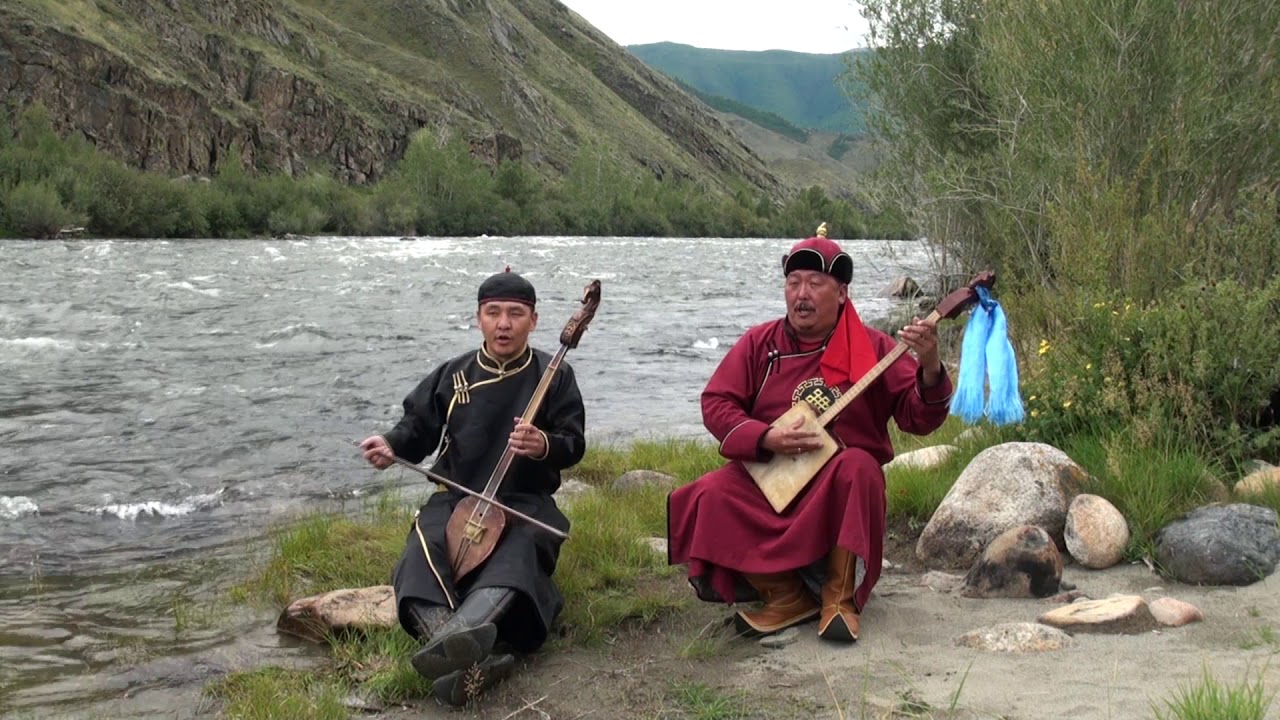 Andre Mongush and Aidyn Sedi sing at the Alash river