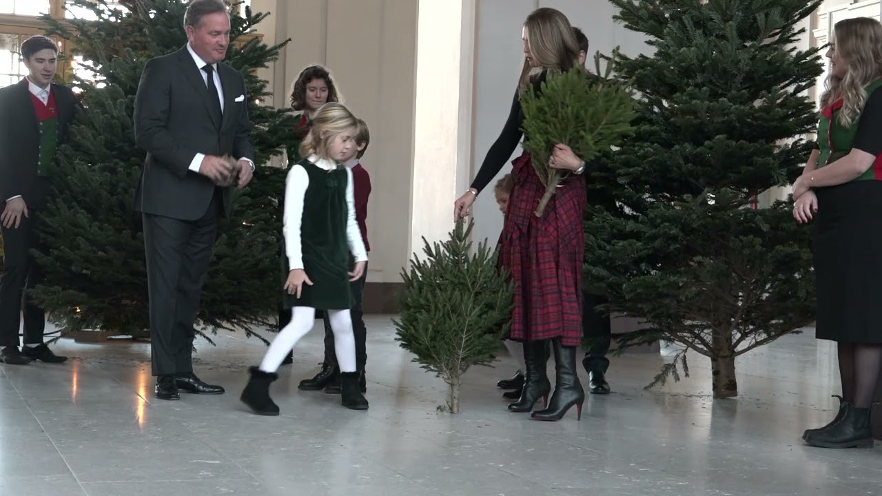 Princess Madeleine of Sweden and kids reciving Christmas Trees