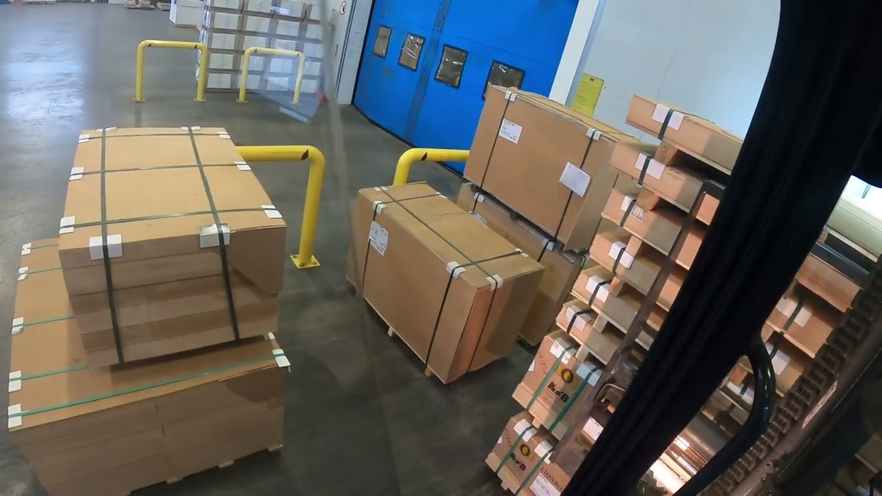 POV Forklift Operator : Unloading a trailer with hardboard
