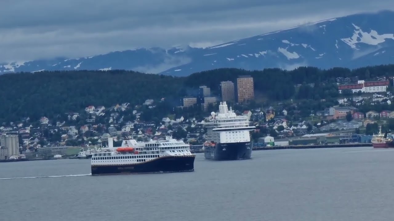 The small coastal cruise ship Havila Capella compared to the huge Mein Schiff 3