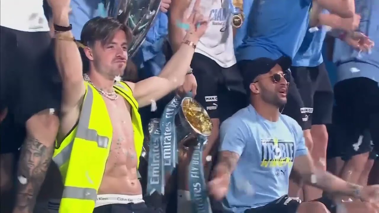 Man City squad including Pep himself sing the song at stage show 