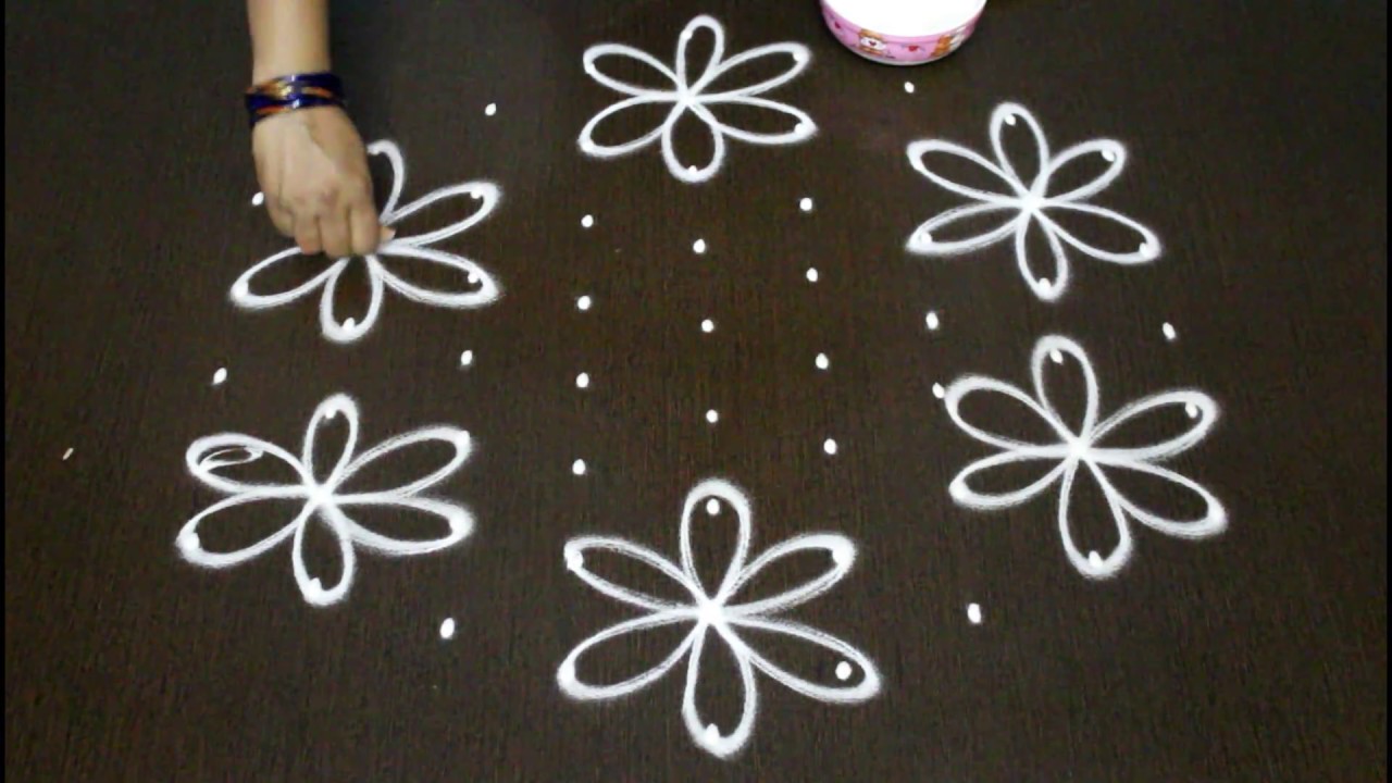 shanku kolam designs with  9 dots - chukkala muggulu designs - creative rangoli designs