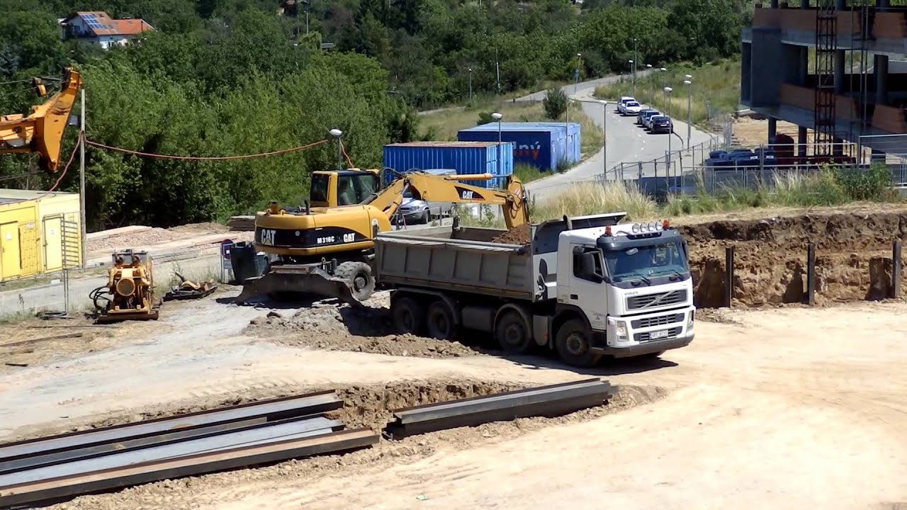 Volvo FM and Cat M316C