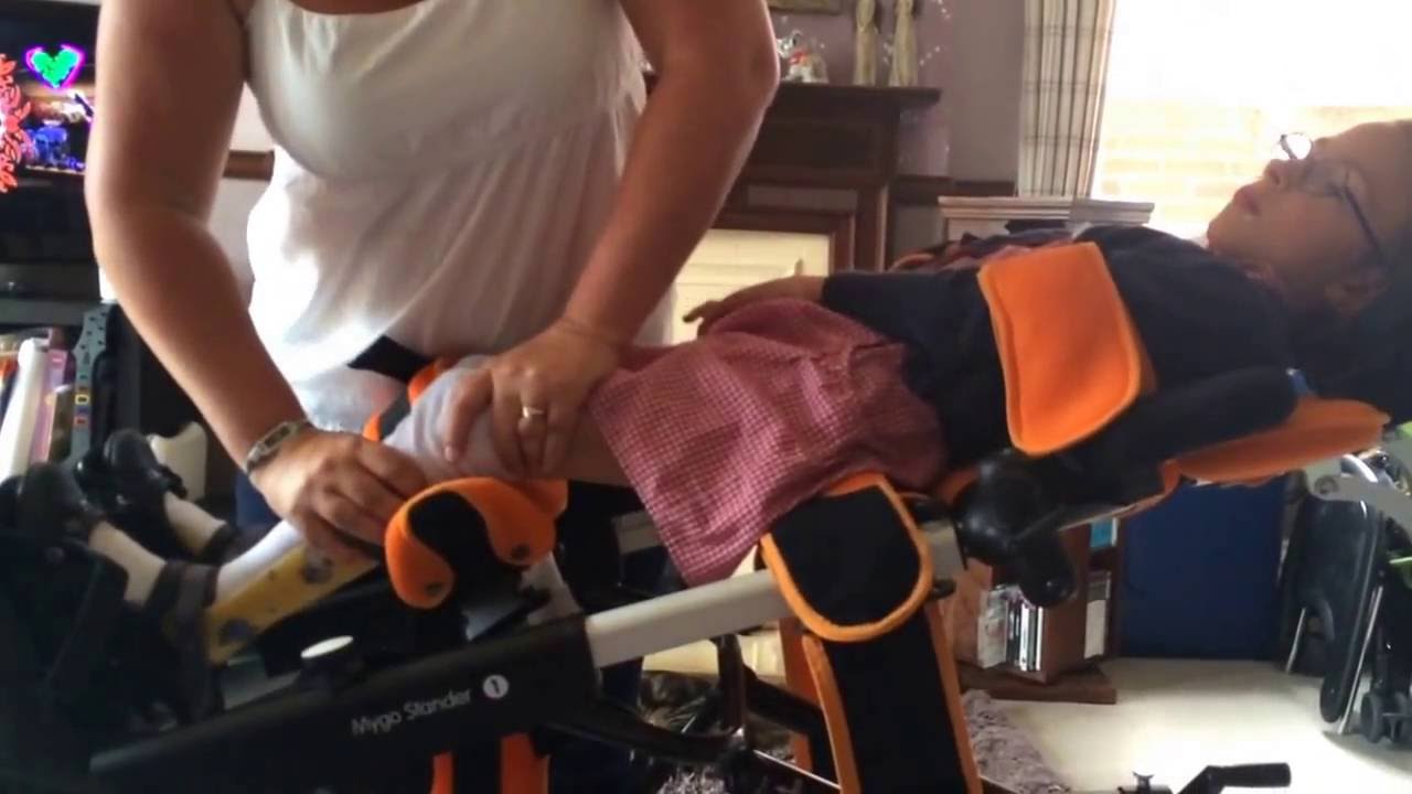 Strapping a CP child into a standing frame