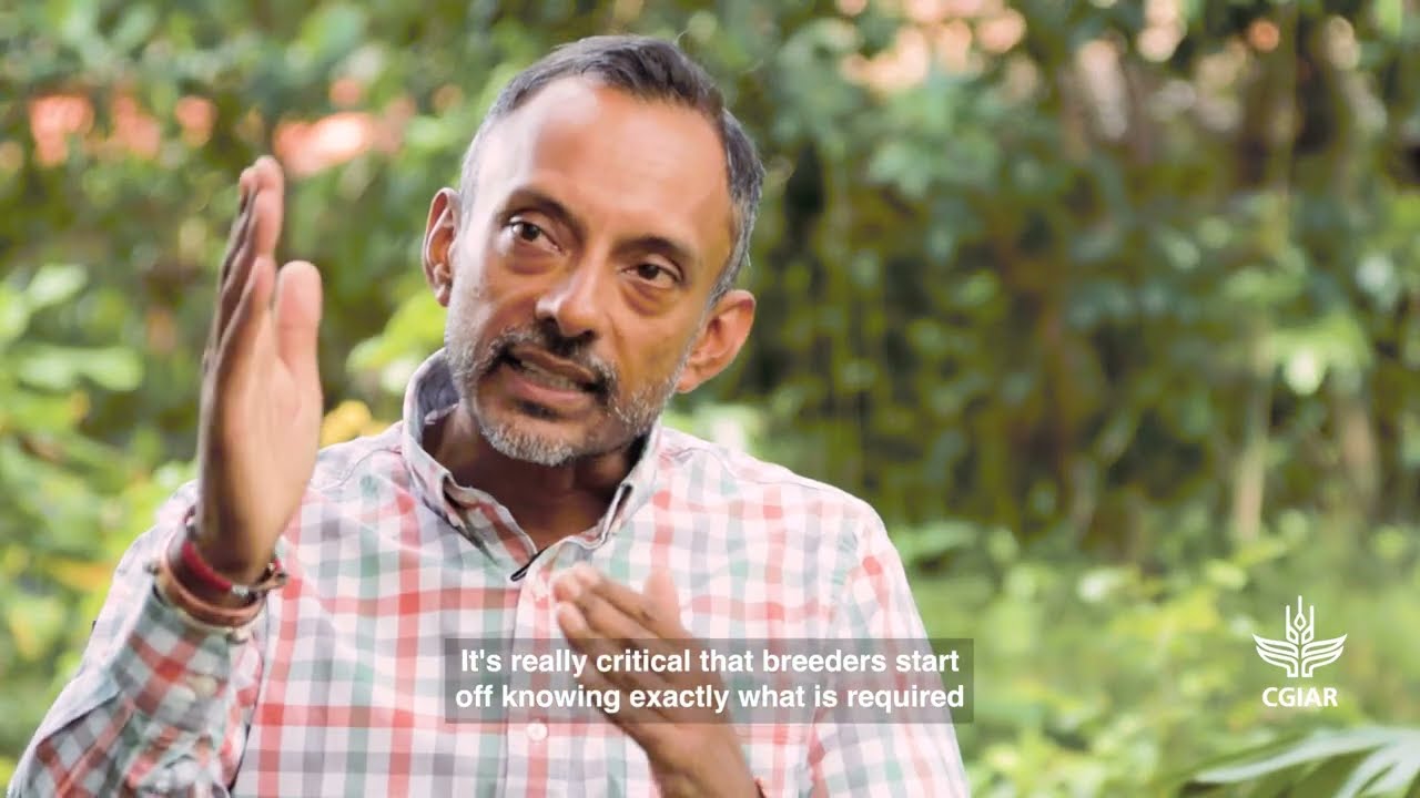 Why do we need to develop new crop varieties and how do we do it?