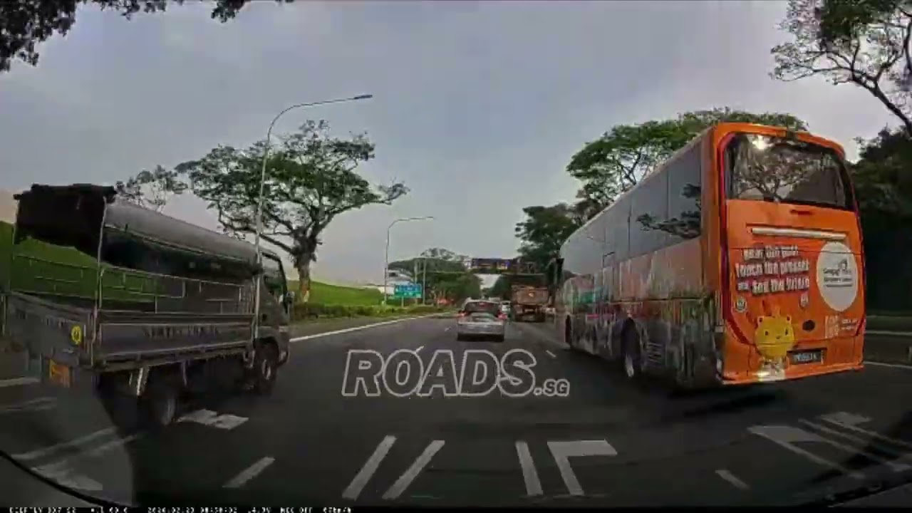 Dangerous driver stopping in the middle of lane to try to cut into another lane