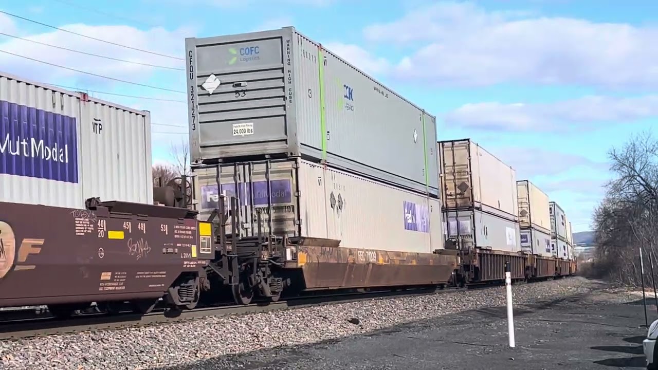 BNSF ES44DC Soloing a NS Intermodal Rolls Away From a Stop
