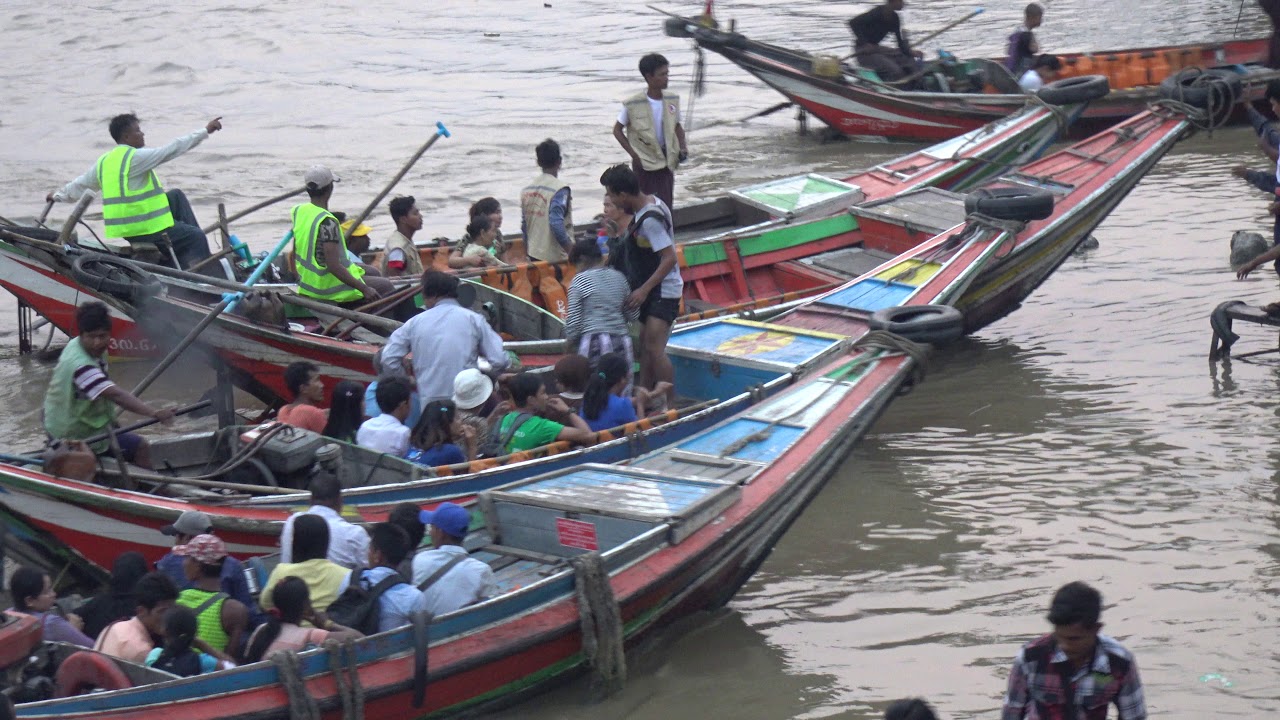 Sampans boarding. River front view. Around 19 street, Yangon. Strictly 12 passengers per boat. 4k
