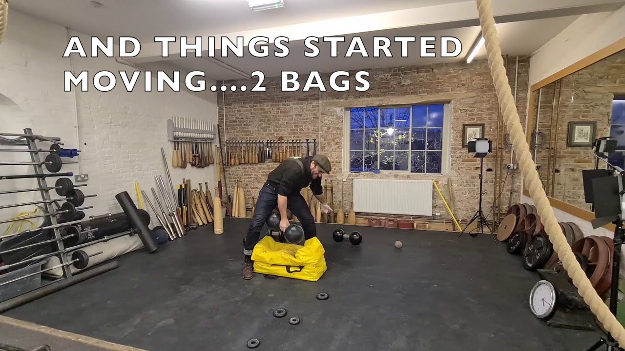 Training to lift the inch dumbbell.