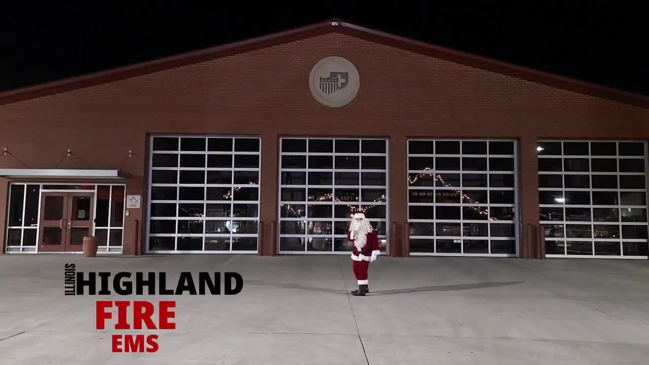 Santa puts on a light show at the Highland Fire Department firehouse