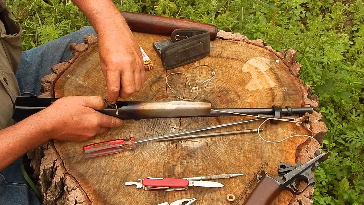 Переустановка возвратной пружины самозарядного ружья Winchester.