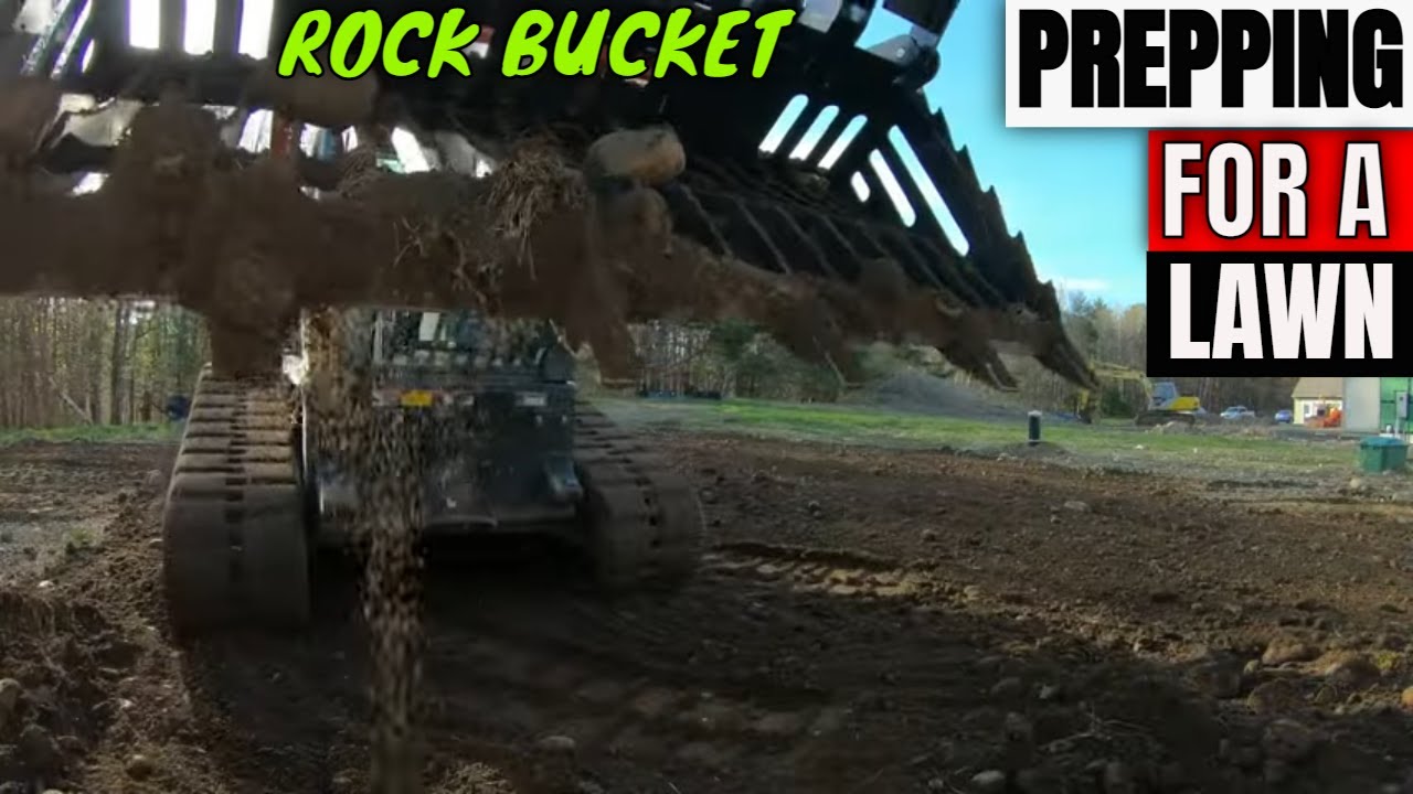 Prepping a lawn for topsoil with a Rock bucket & Harley rake