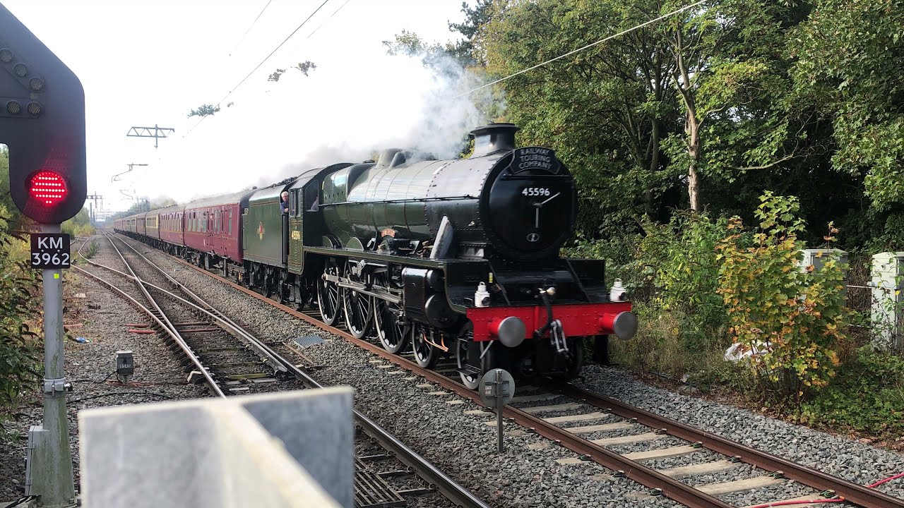 Corby station the Yorkshireman Bahamas Steam train 45596 going through high speed train 16/10/21