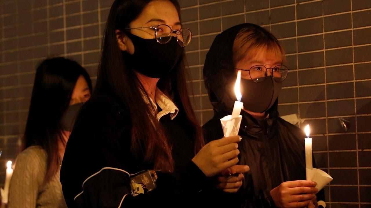 Hong Kong protestors gather outside a parking garage where a student died Friday after a clash| Live