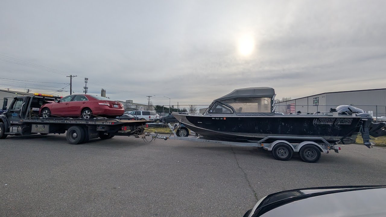 A Boat, a Toyota Camry and a Kia Sportage