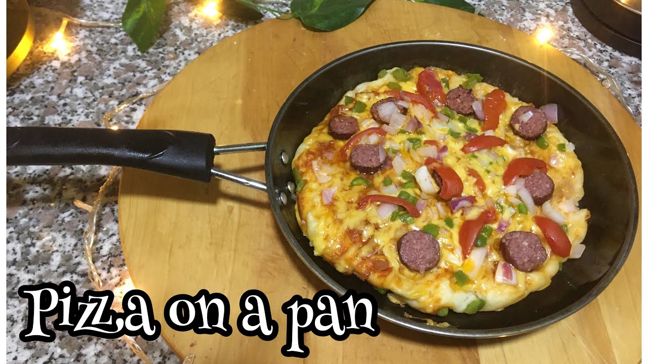Guteka pizza || dore uko wateka pizza kwipanu wibereye murugo ( how to make home made pizza)
