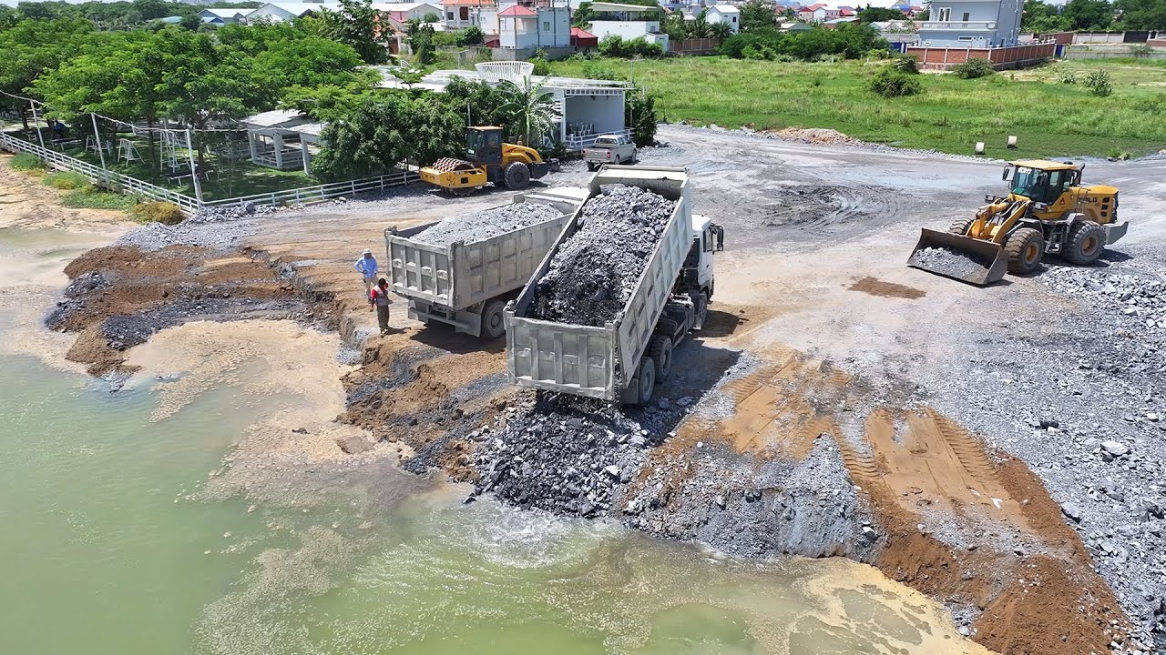 Impressive Working!! Shantui Bulldozer Pushing Stone Filling The Lake With 25T Dump Trucks