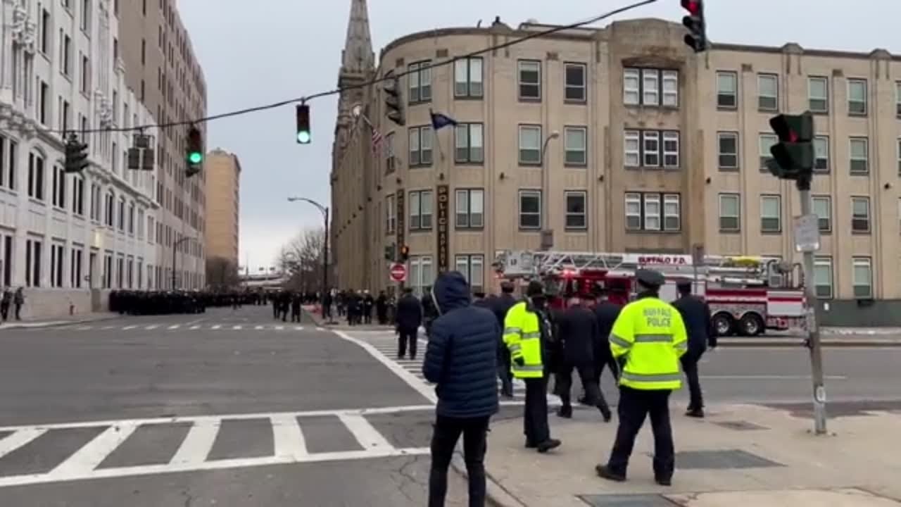 Firefighters line up along procession route for funeral of Jason Arno
