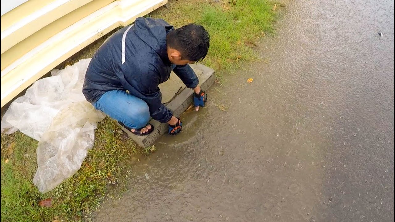 Removal Plastic And Rubbish Clogging Drains On Roads After Heavy Rains Near City #unclogging #drain