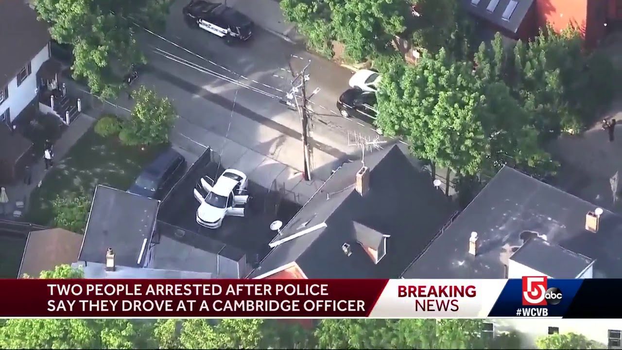 2 people arrested after police say they drove at a Cambridge officer