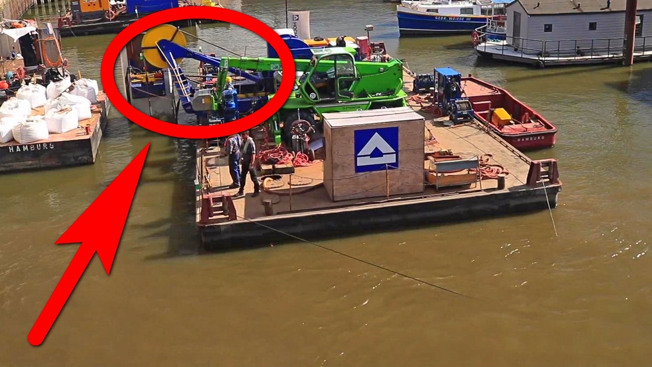 HEAVY LIFT BARGE WITH CRANE LIFTING CONCRETE BLOCKS