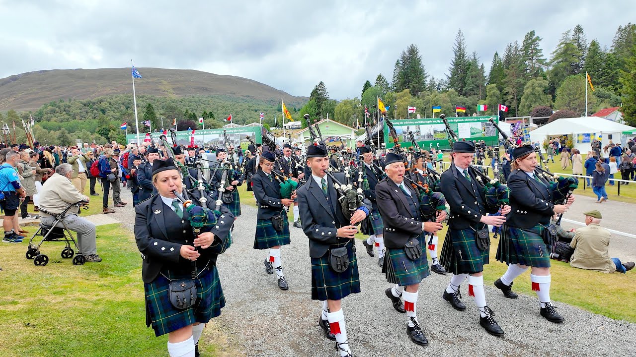 Kintore Pipe Band march off playing Bonnie Galloway during 2025 Braemar Gathering Games in Scotland