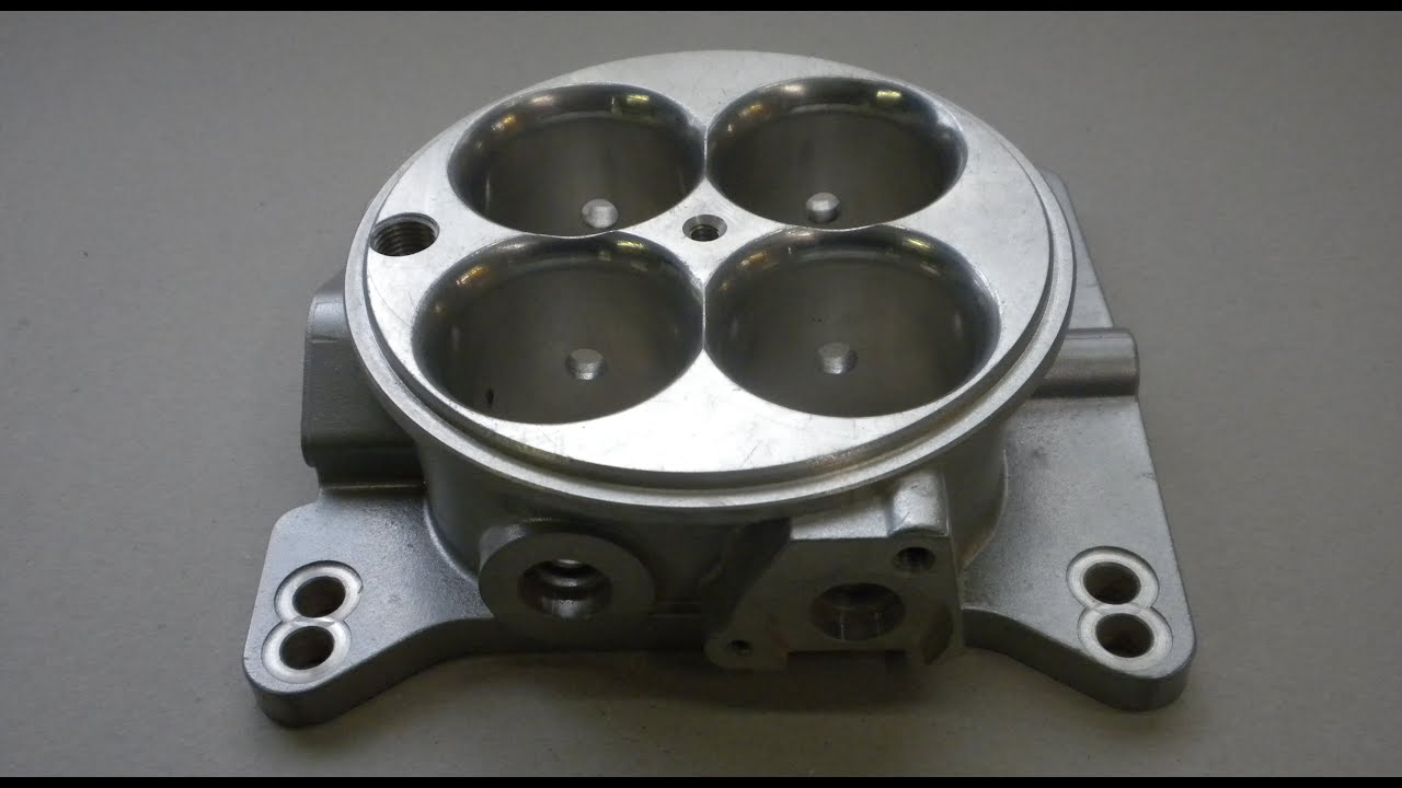 Casting a four barrel throttle body Part 3:-  Spraying the die and making the castings.