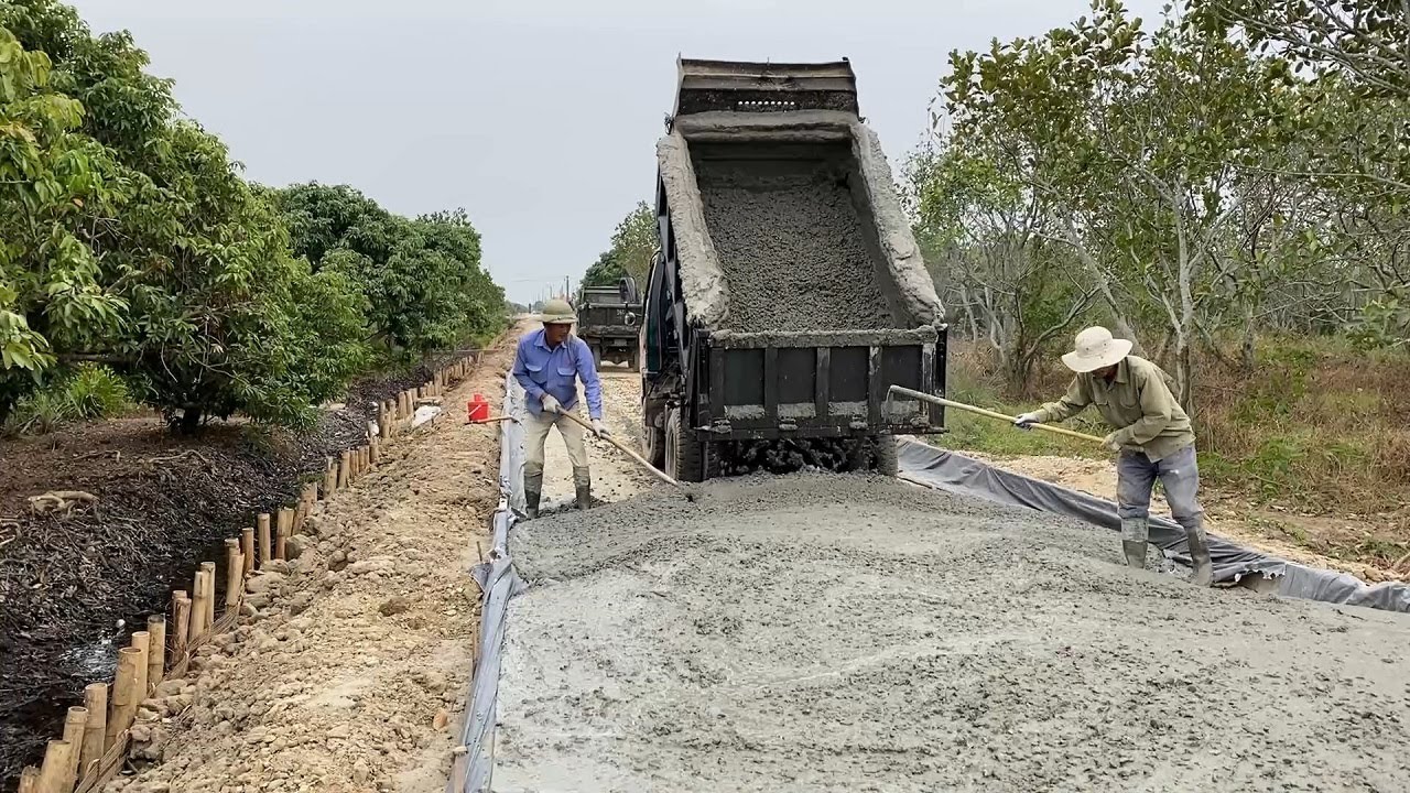 Concrete Road Construction Technology With Concrete Mixer Truck And Trucks - Construction Works