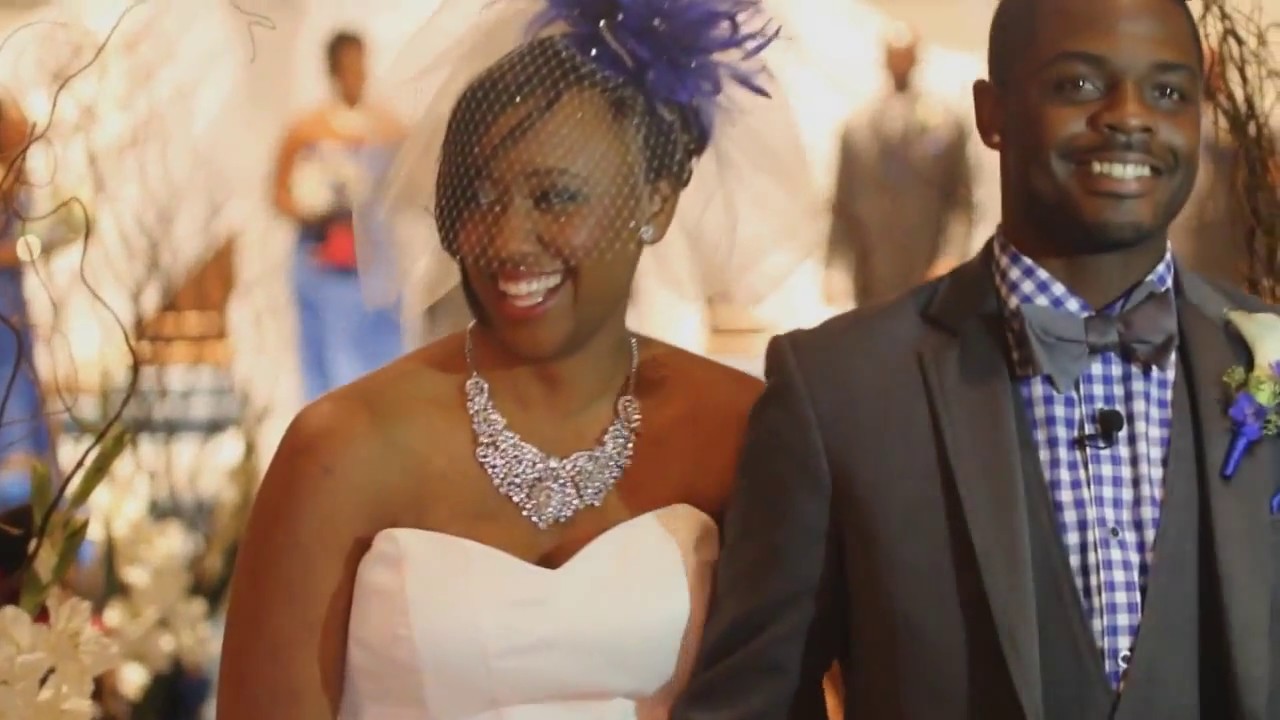 Two beautiful people jump the broom in this African American wedding