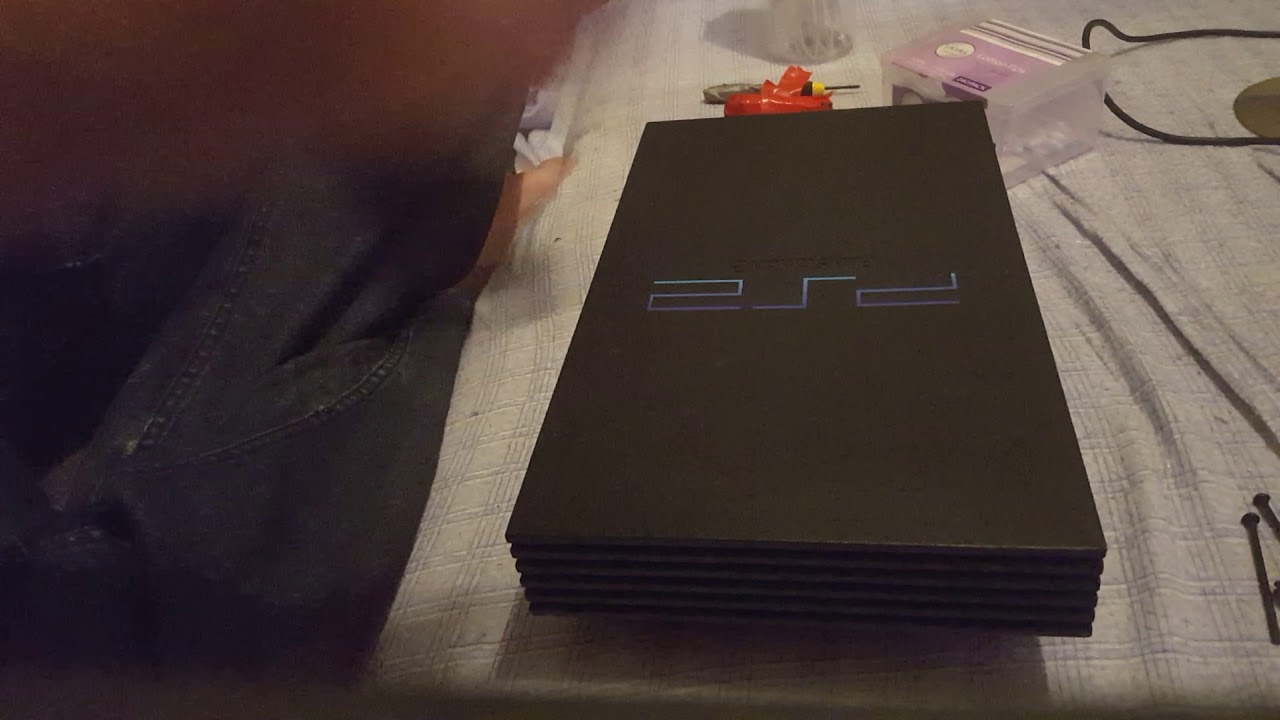 Dismantling a ps2 50002 models tips and tricks on cleaning these and pulling the console apart