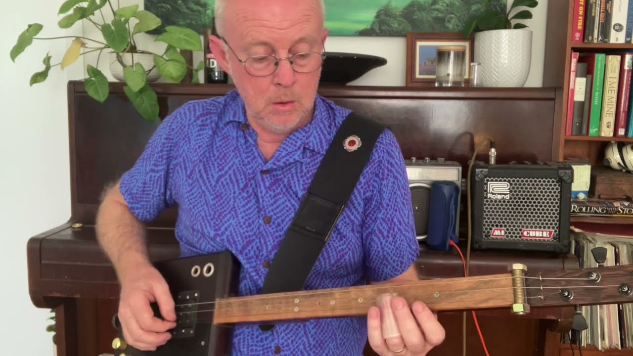 Nigel MCTRUSTRY - How to play AC/DC Rock n Roll Damnation on 3 string fretless cigar box guitar