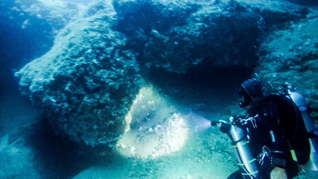 Scuba Diving in the Rocky Cracks in the Sea of Taormina, Sicily, Italy